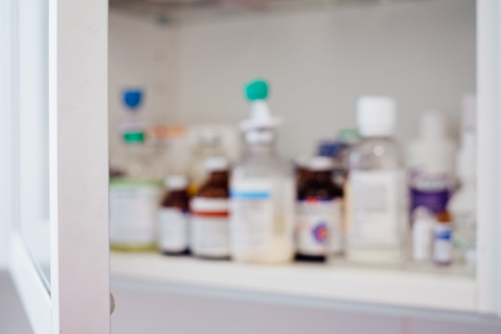 Medicine bottles on a shelf - free stock photo