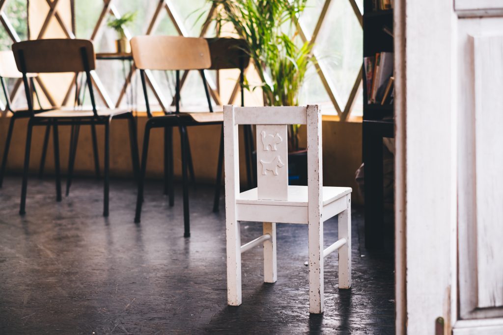 Damaged kid’s chair in a retro interior - free stock photo