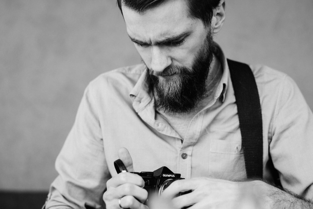 A man holding an analog camera 2 - free stock photo