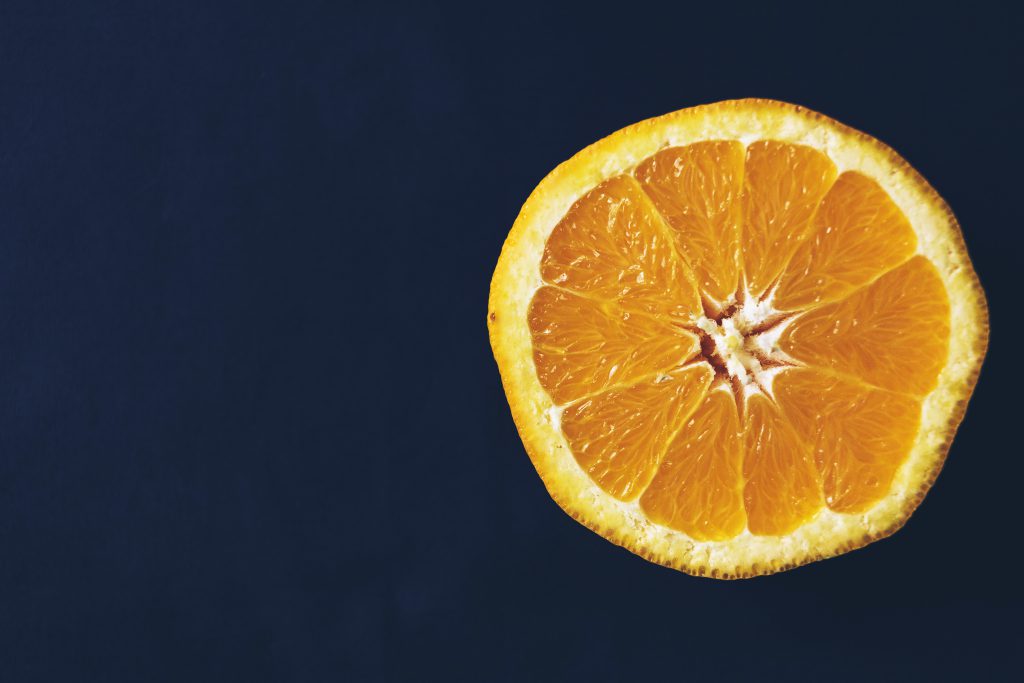 An orange cut in half - free stock photo