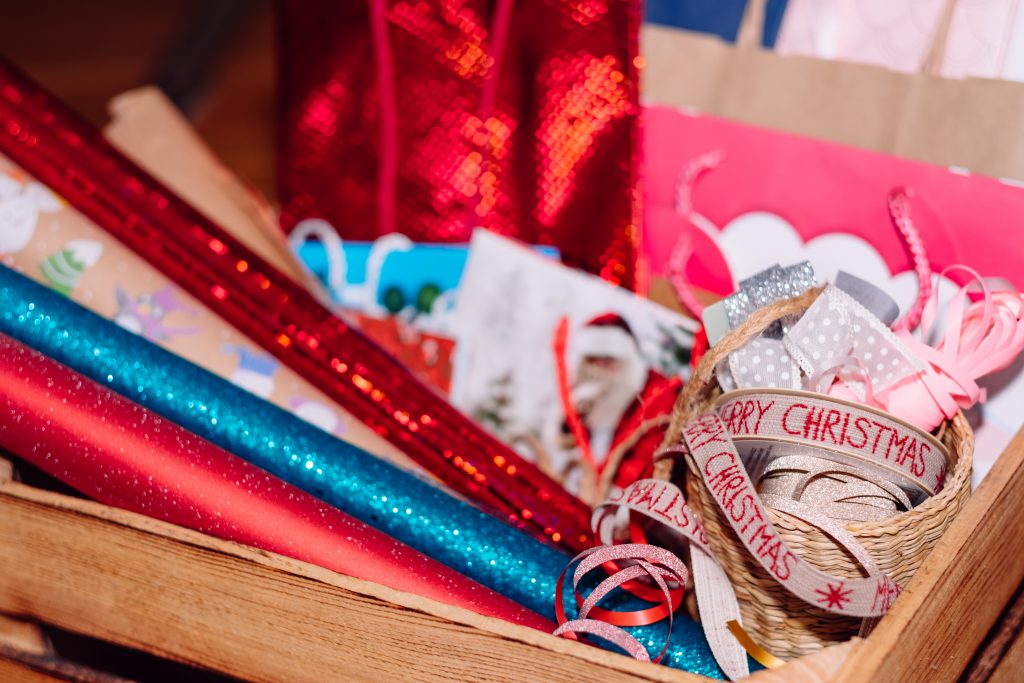 Christmas bags, wrapping paper and ribbons - free stock photo
