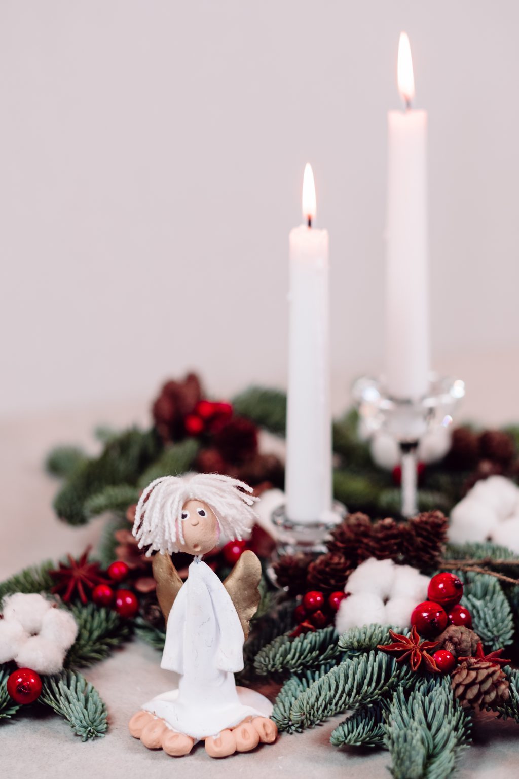 Christmas spruce decoration with candles and an angel - free stock photo