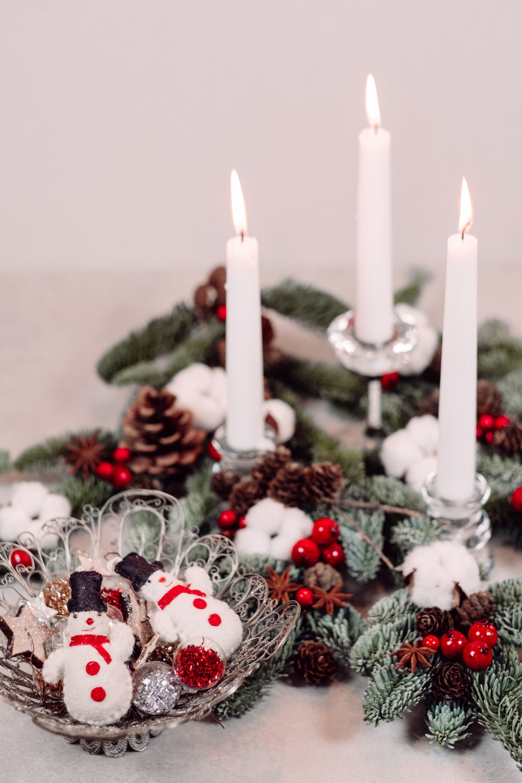Christmas spruce decoration with candles and snowmen - free stock photo