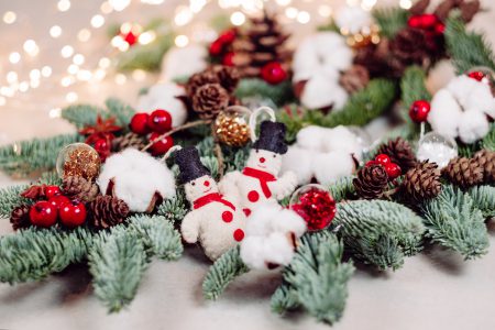 Christmas spruce decoration with snowmen and lights - free stock photo