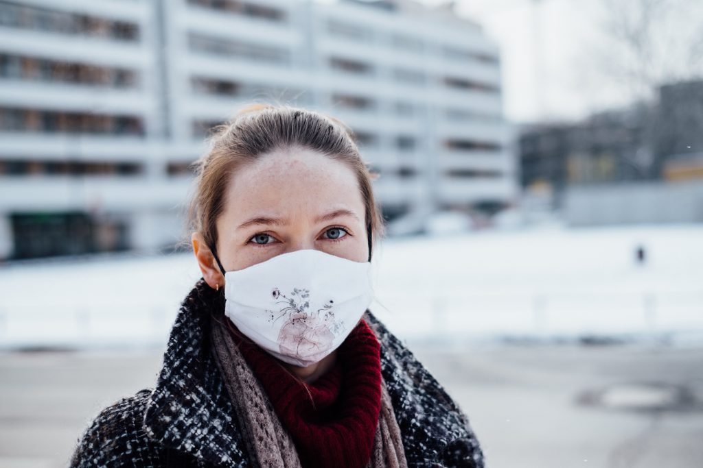 A female wearing a protective face mask - free stock photo