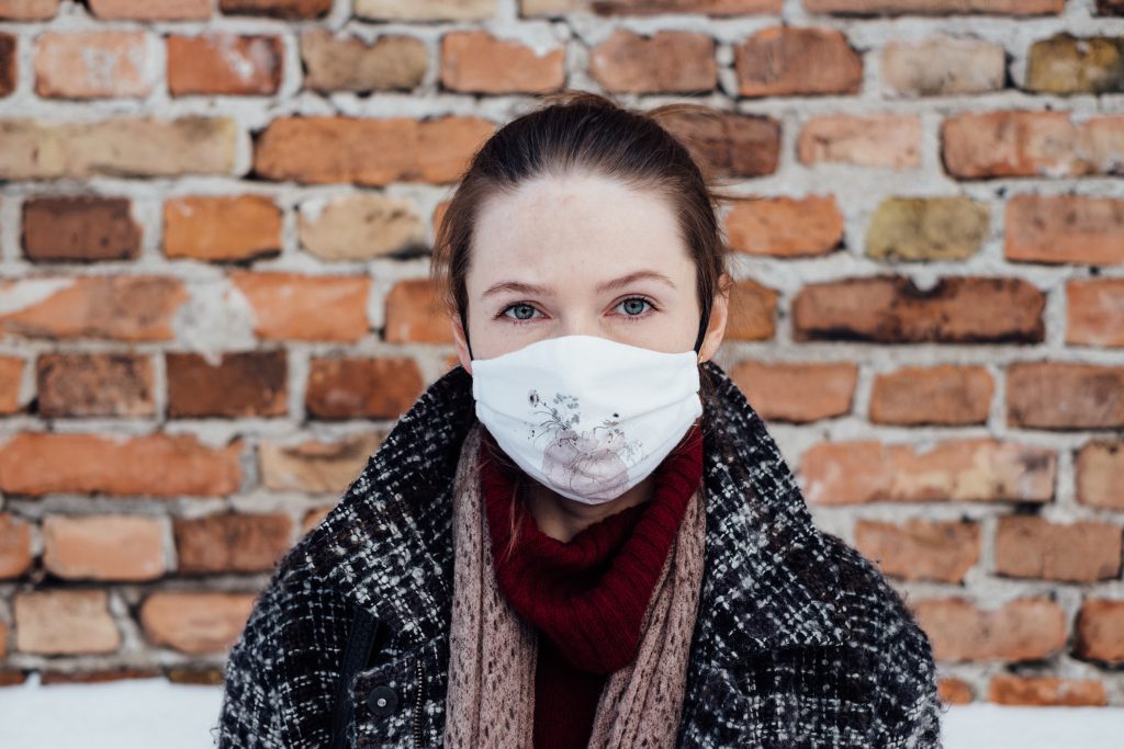 A female wearing a protective face mask 3 - free stock photo