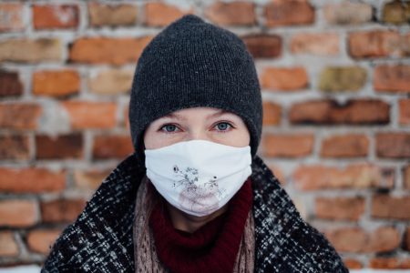 A female wearing a protective face mask 4 - free stock photo