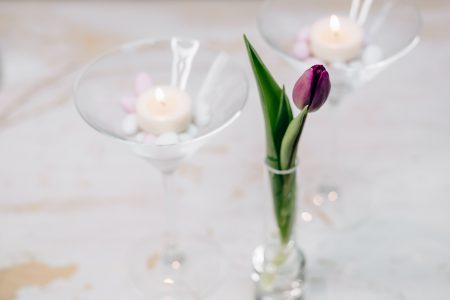 Table candle decoration with a purple tulip - free stock photo