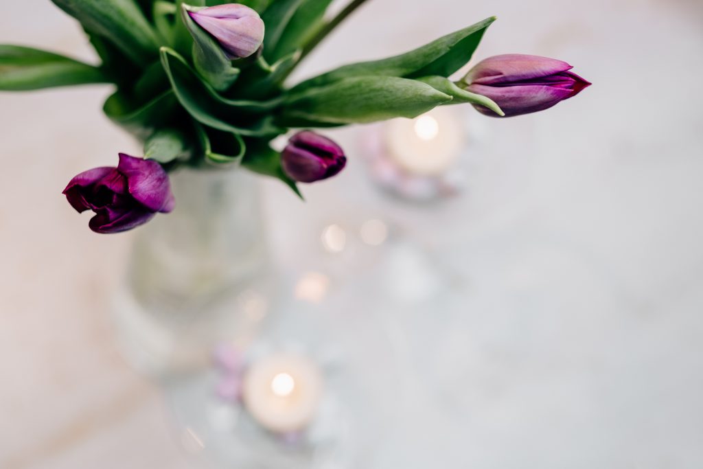 Table candle decoration with purple tulips 3 - free stock photo