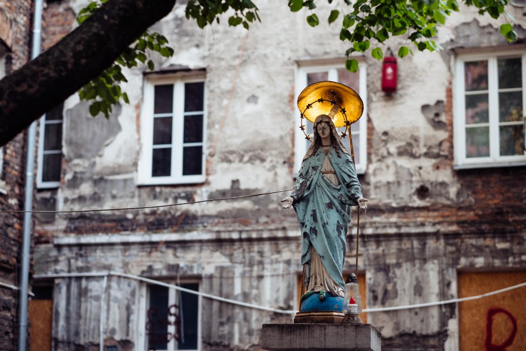 Catholic holy figure worship place outside a poor neighbourhood building 3 - free stock photo