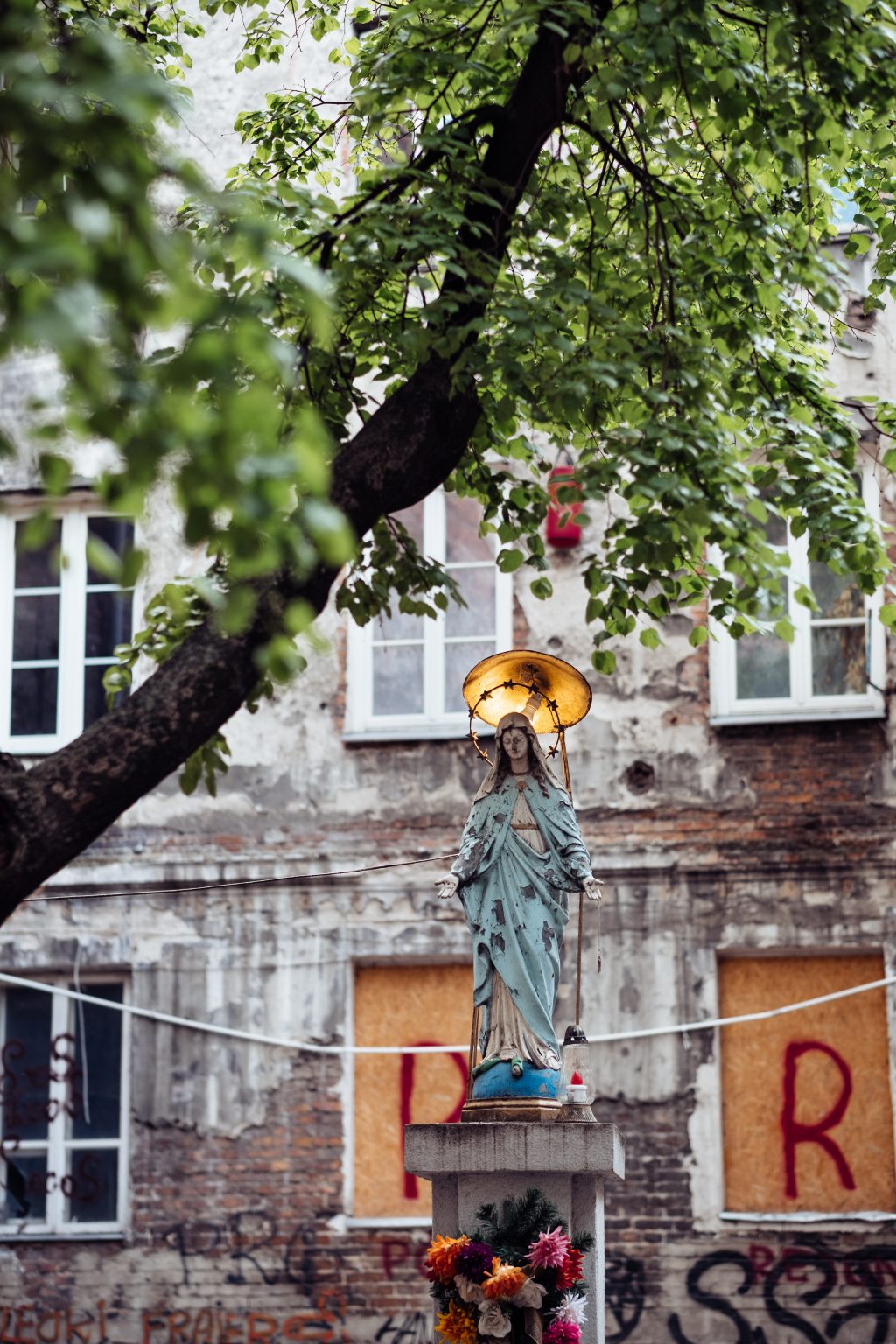 Catholic holy figure worship place outside a poor neighbourhood building 4 - free stock photo