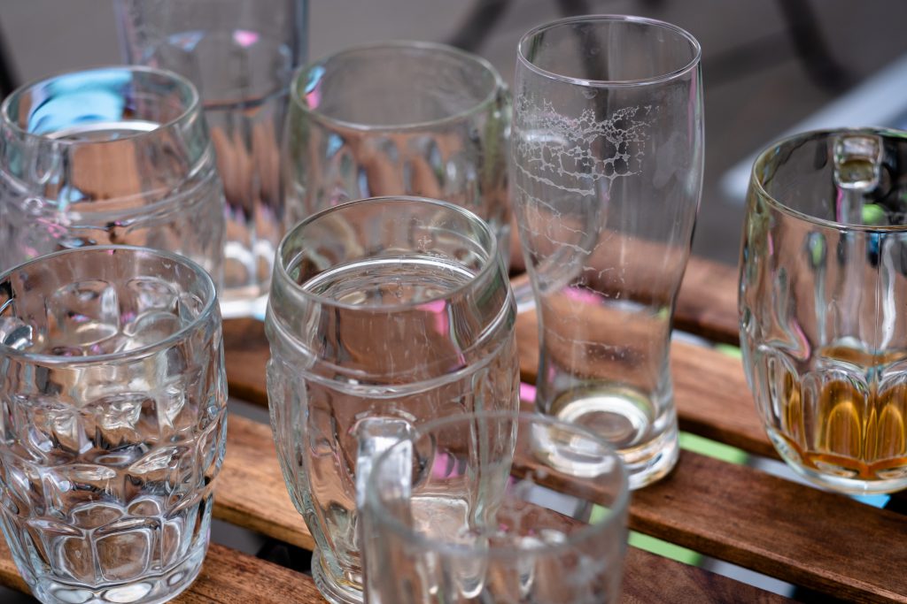 Empty beer glasses on an outdoor table - free stock photo