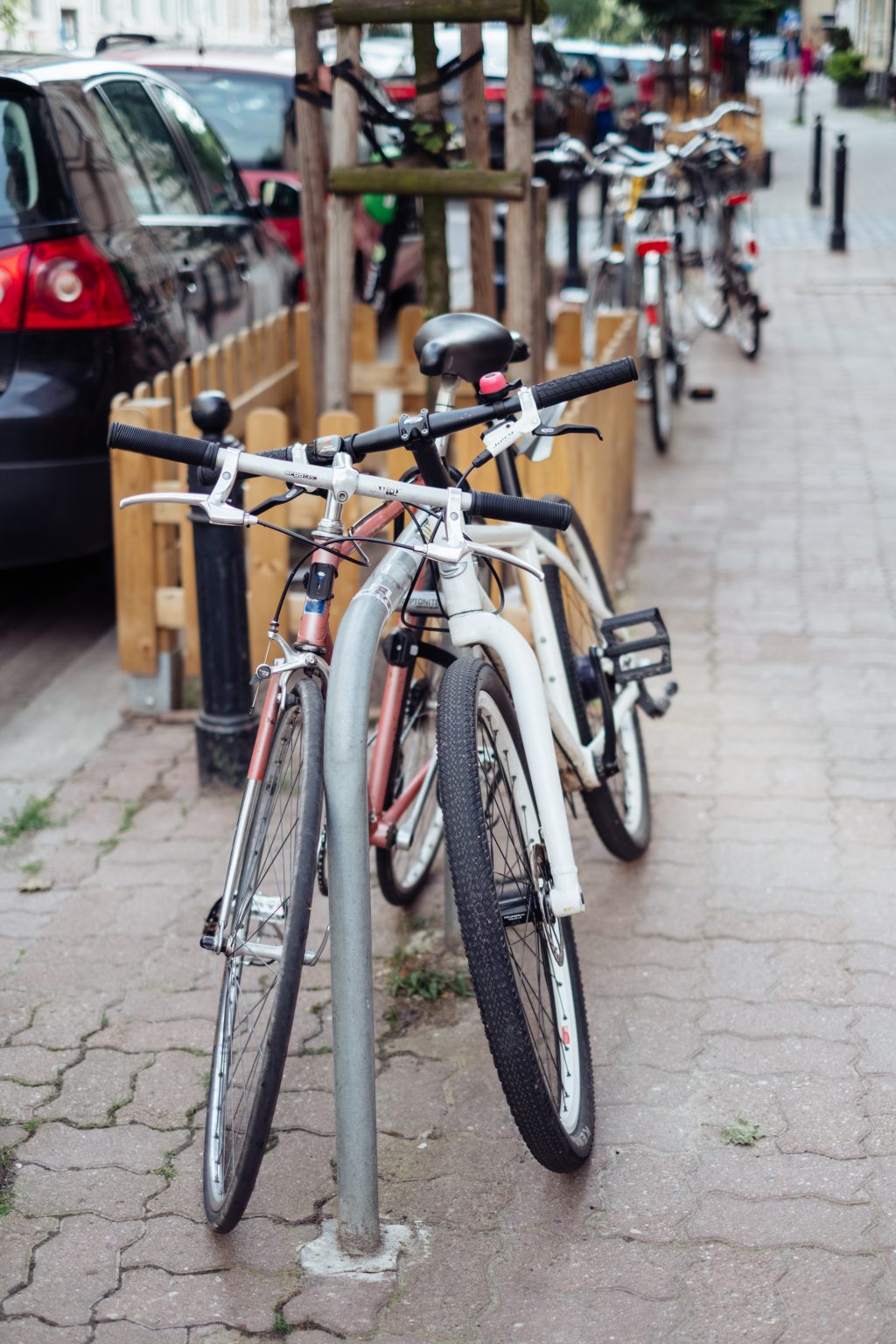 Bicycles attached to bike racks 2 - free stock photo