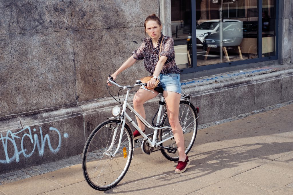 Female on a bicycle in the city - free stock photo