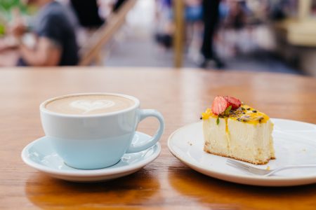 Latte and a cheesecake on a café table 3 - free stock photo