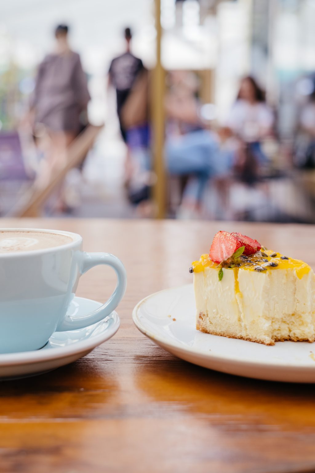 Latte and a cheesecake on a café table 4 - free stock photo