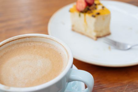 Latte and a cheesecake on a café table 5 - free stock photo