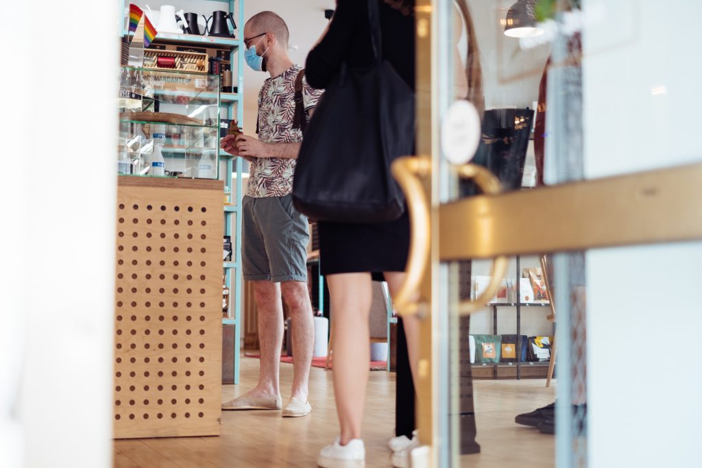 Male customer waiting at the counter in a café 2 - free stock photo