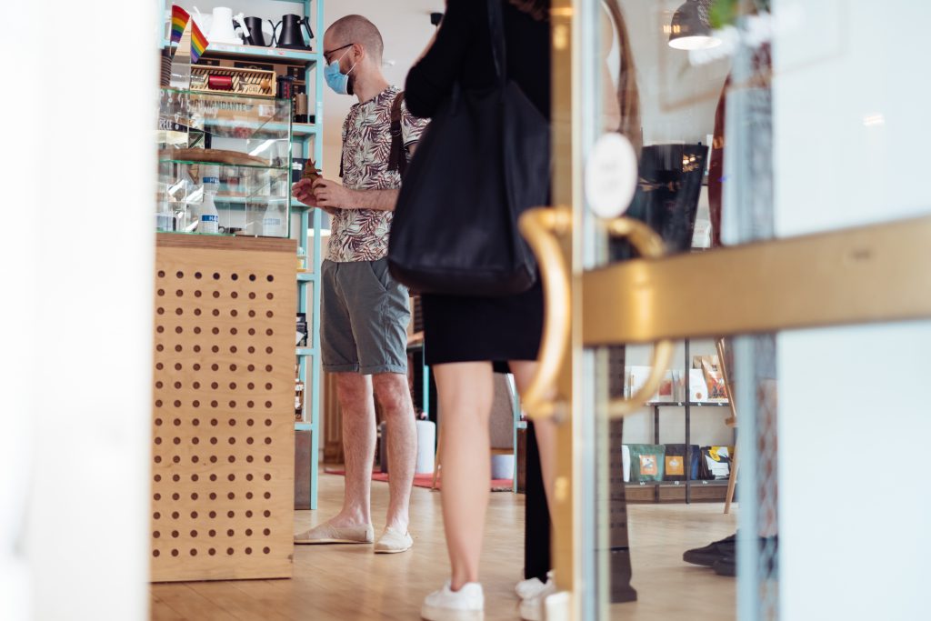 male_customer_waiting_at_the_counter_in_