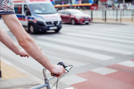 Male cyclist waiting for a green light at the road crossing - free stock photo