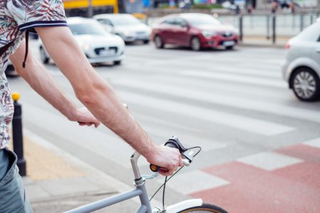 Male cyclist waiting for a green light at the road crossing 2 - free stock photo
