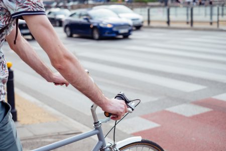 Male cyclist waiting for a green light at the road crossing 3 - free stock photo