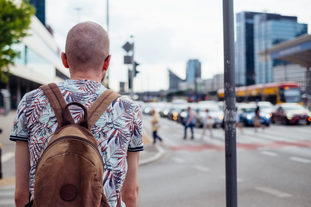 Male waiting for a green light at the road crossing - free stock photo