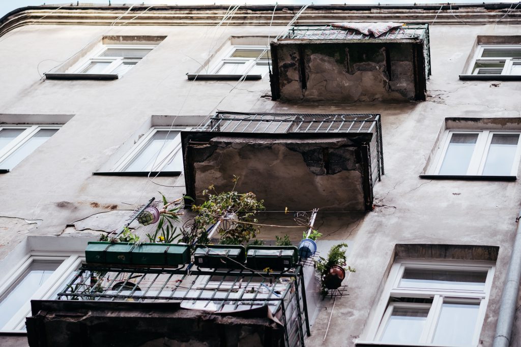 Balconies on a neglected building - free stock photo
