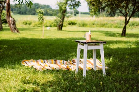 Cup of coffee on a vintage stool outdoors - free stock photo