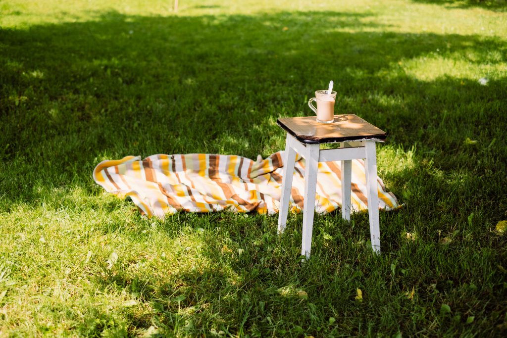 cup_of_coffee_on_a_vintage_stool_outdoor