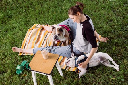 Female having a coffee outdoors with dogs 3 - free stock photo