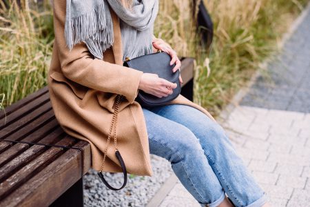 Female holding her purse on an autumn day - free stock photo
