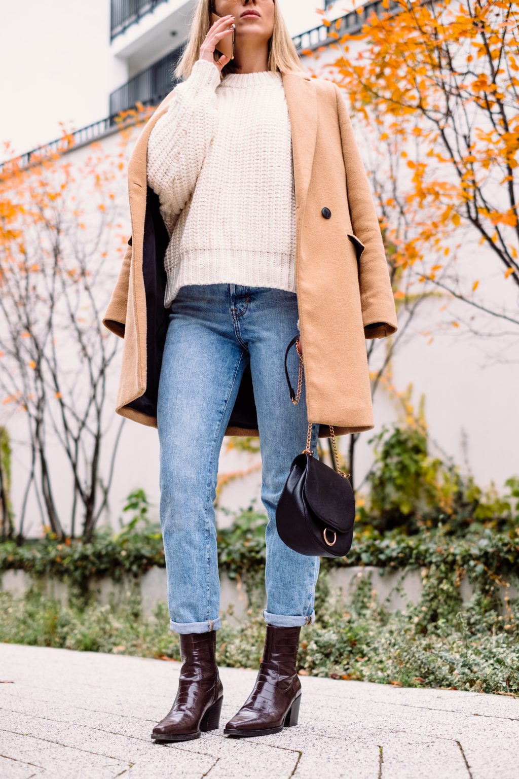 Female talking on the phone on an autumn day - free stock photo