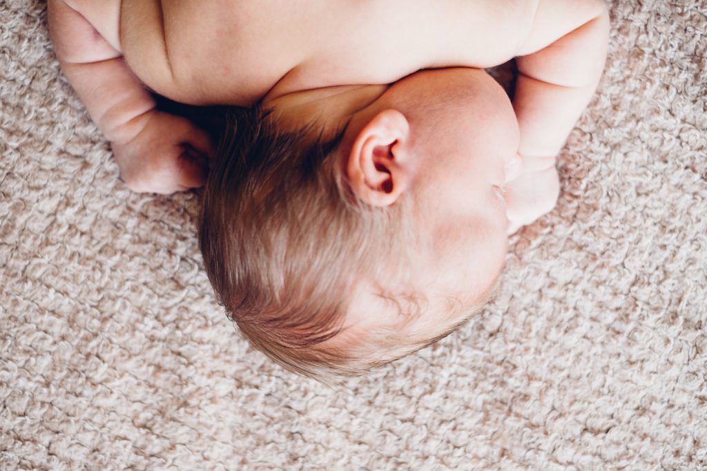 Newborn baby’s head and shoulders - free stock photo