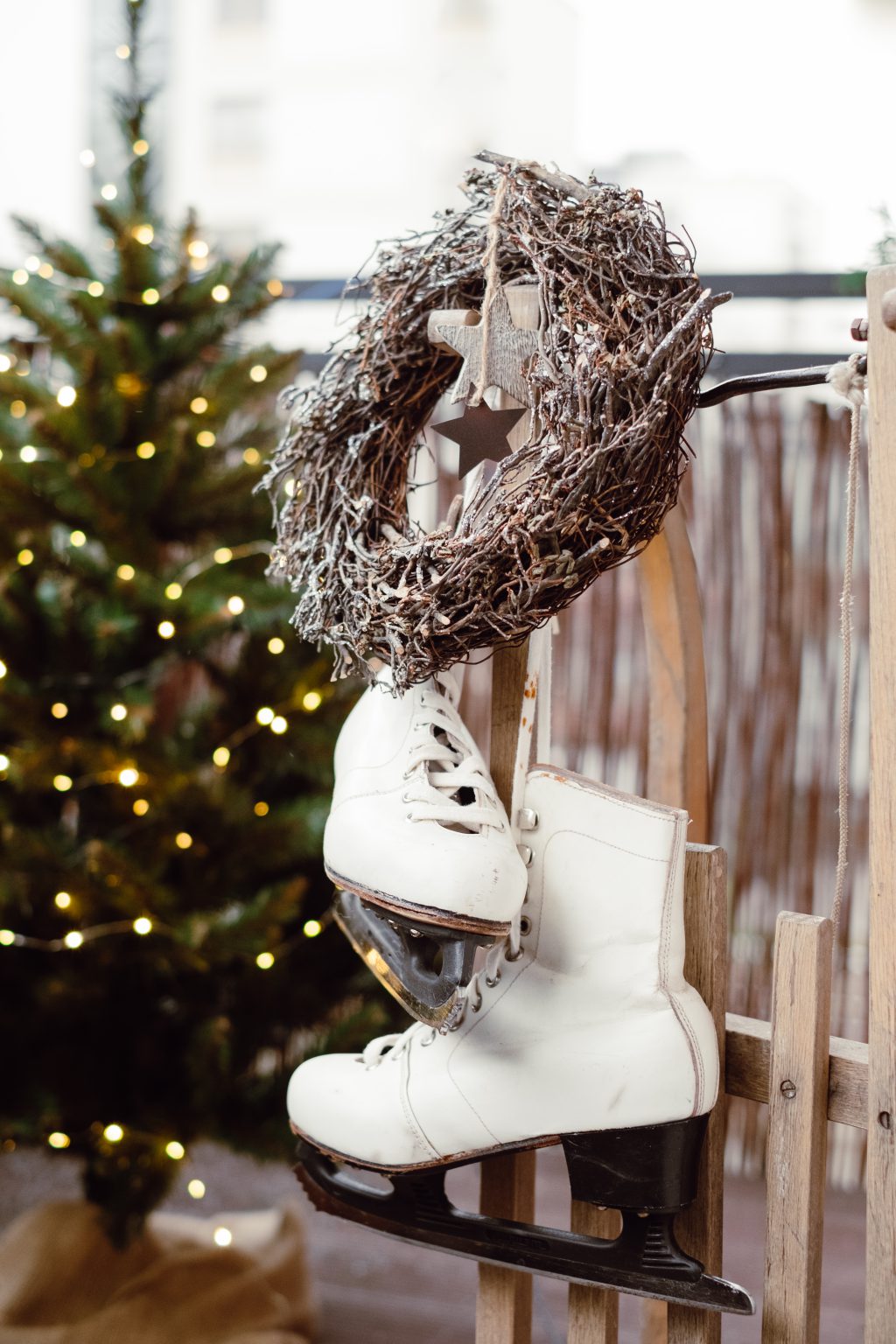 Christmas wreath and vintage ice skates on a wooden sled 3 - free stock photo