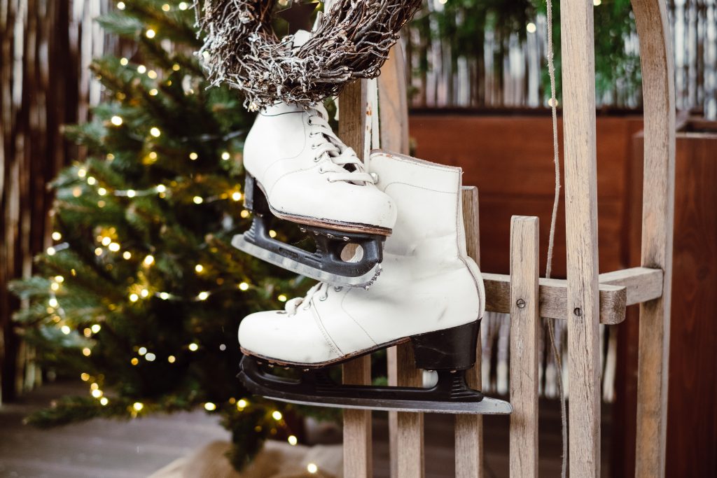 Christmas wreath and vintage ice skates on a wooden sled 4 - free stock photo