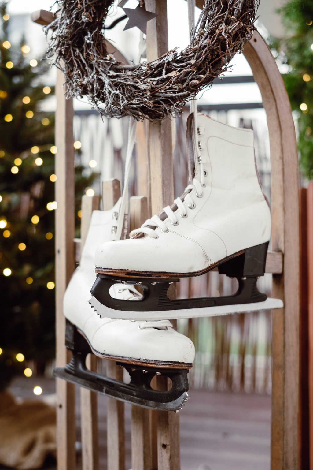 Christmas wreath and vintage ice skates on a wooden sled 5 - free stock photo