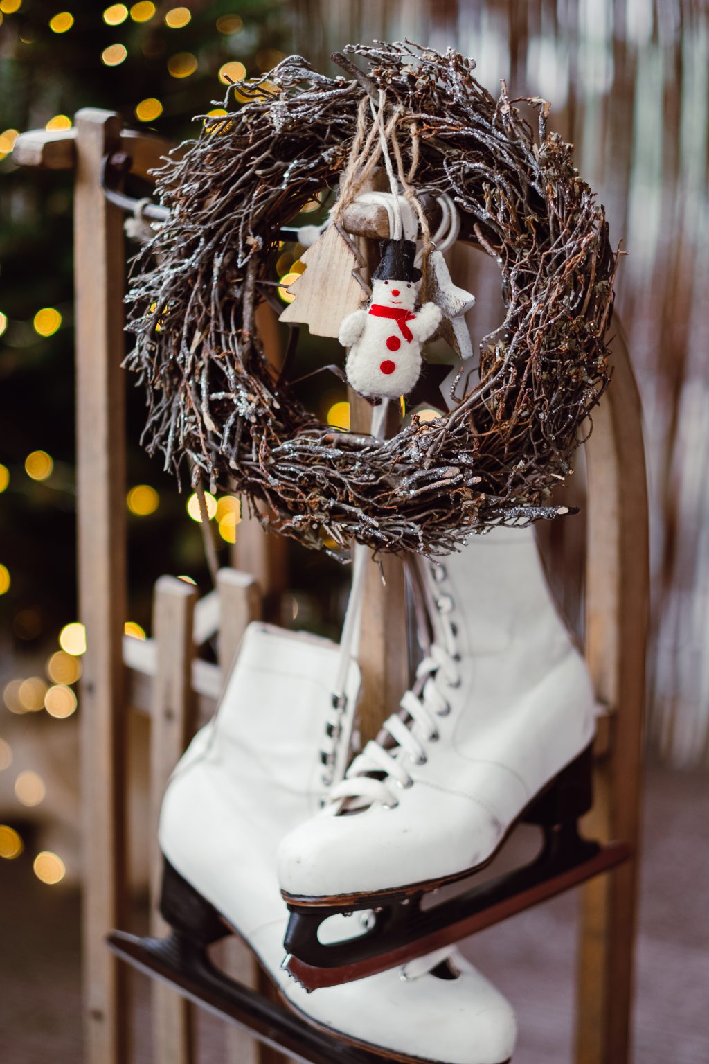 Christmas wreath and vintage ice skates on a wooden sled 6 - free stock photo