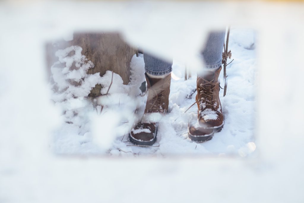 Broken mirror reflection of a snow covered shoes - free stock photo