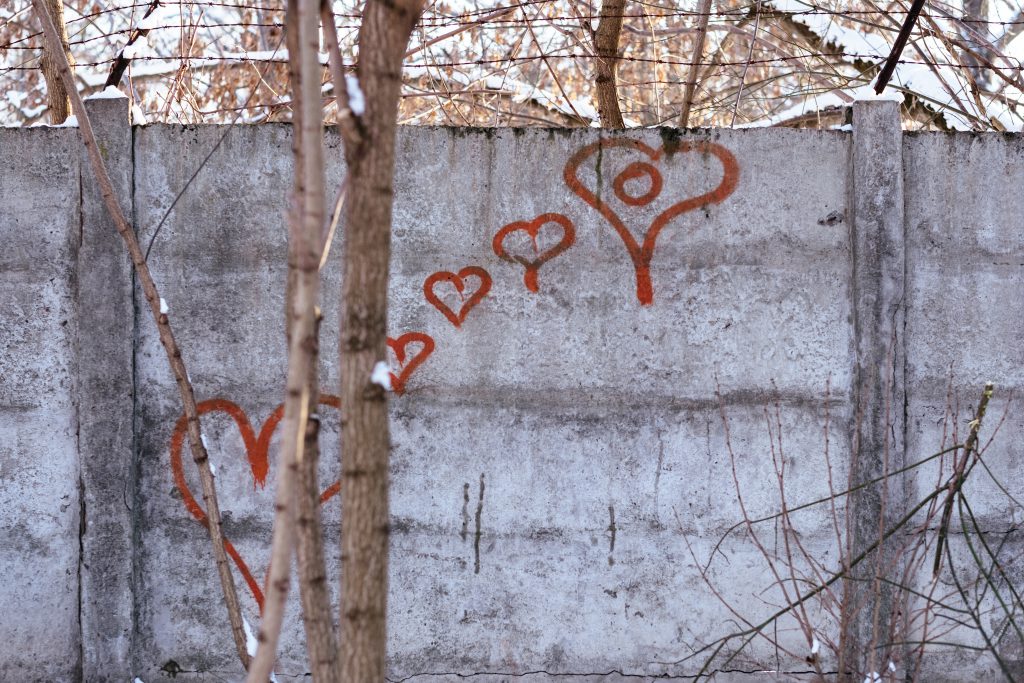 Hearts graffiti on the wall on a winter afternoon - free stock photo
