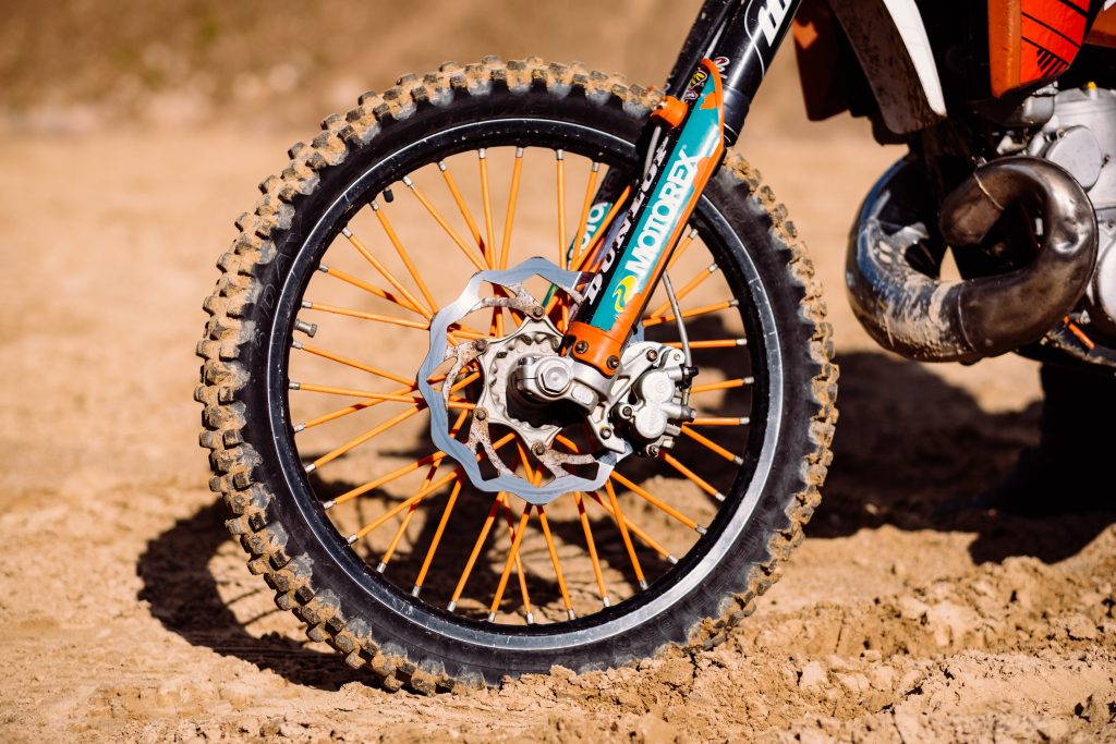 Motorbike at a sand quarry detail - free stock photo