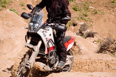Motor biker riding through a sand quarry 3 - free stock photo