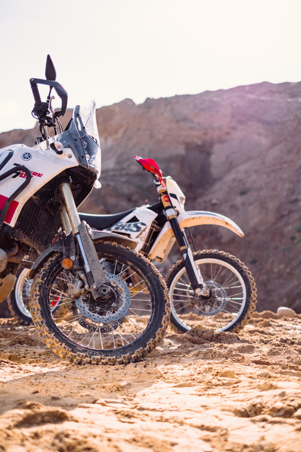 Two motorbikes at a sand quarry details 2 - free stock photo