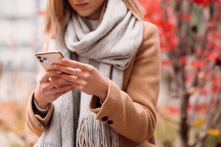 Female holding her phone on an autumn day closeup 6 - free stock photo
