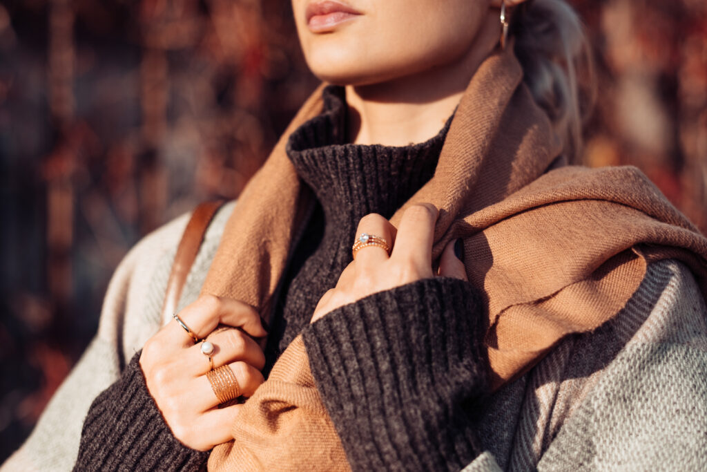 Female wearing a coat on a sunny autumn afternoon closeup - free stock photo