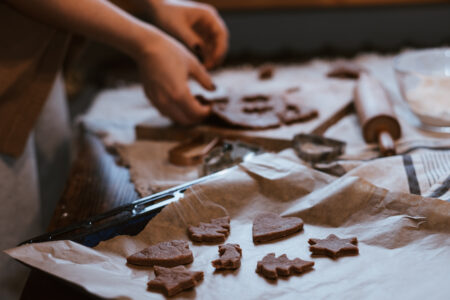 Cutting out gingerbread Christmas biscuits 10 - free stock photo