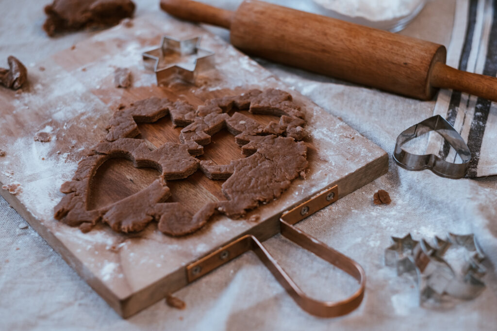 Cutting out gingerbread Christmas biscuits 11 - free stock photo