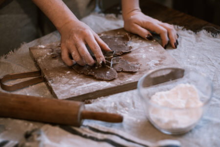Cutting out gingerbread Christmas biscuits 2 - free stock photo