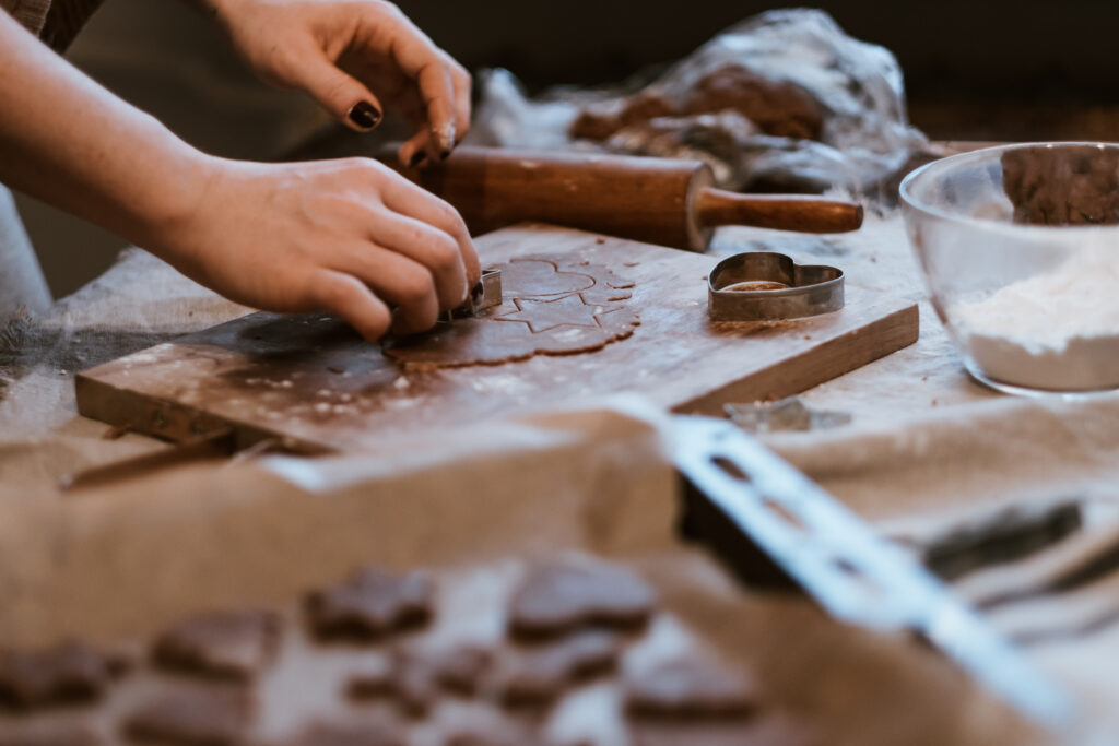 Cutting out gingerbread Christmas biscuits 9 - free stock photo