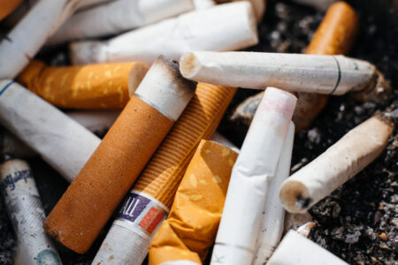 Discarded cigarettes butts closeup - free stock photo